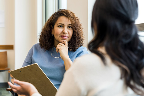 Woman consulting with a doctor - behavioral health