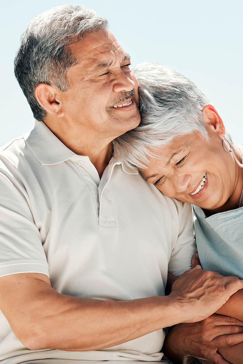 Couple embrace and smile