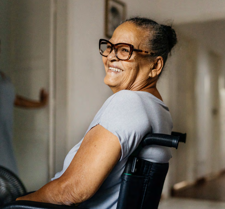 Woman smiling sitting in wheelchair