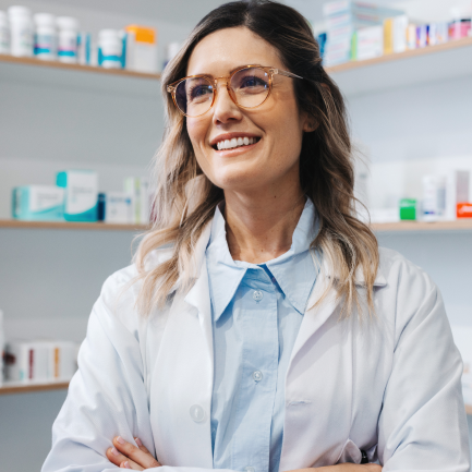 Bespectacled and smiling pharmacist