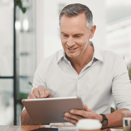 Gentleman interacts with computer tablet