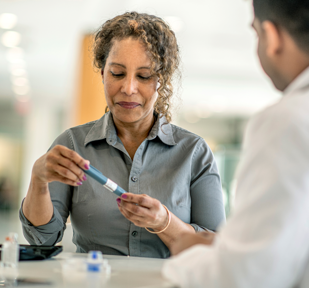 A pharmacist and patient discuss a diabetes drug