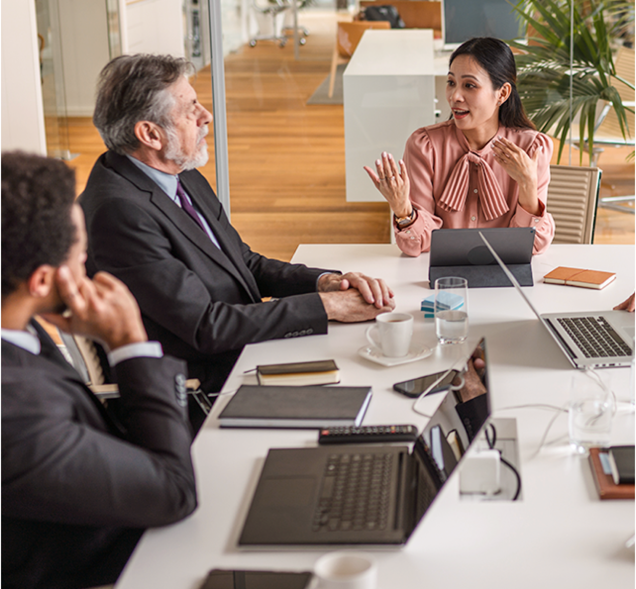 Colleagues meet at a conference table