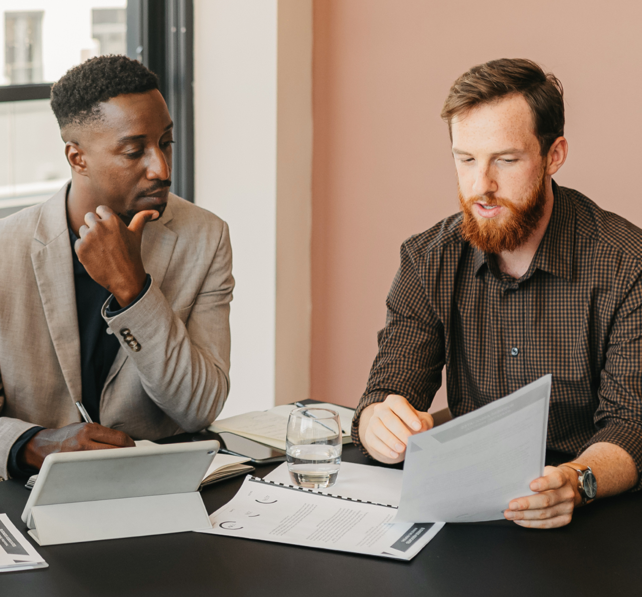 Colleagues review documents together