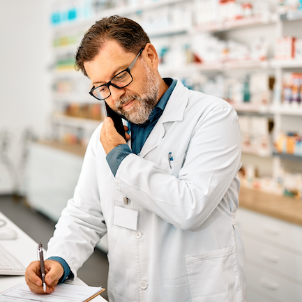 A pharmacist talks on the phone.