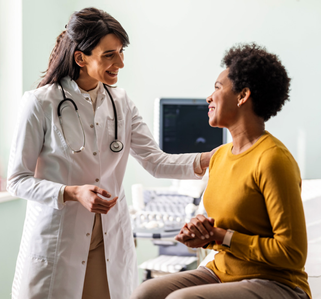 smiling doctor comforts her patient