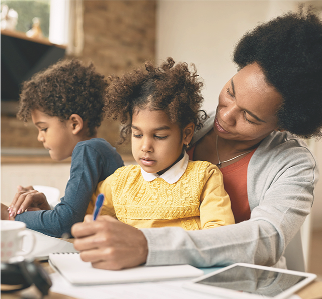 woman enjoying quality time with her two grandchildren