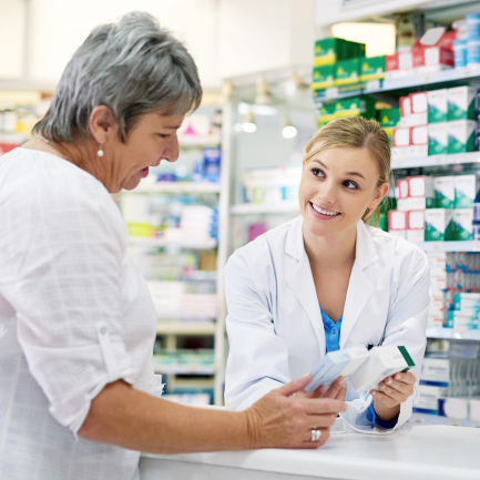 A pharmacist assists a patient