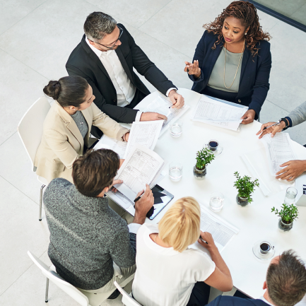 A group of people sitting around a table