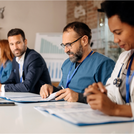 Adults looking down at documents