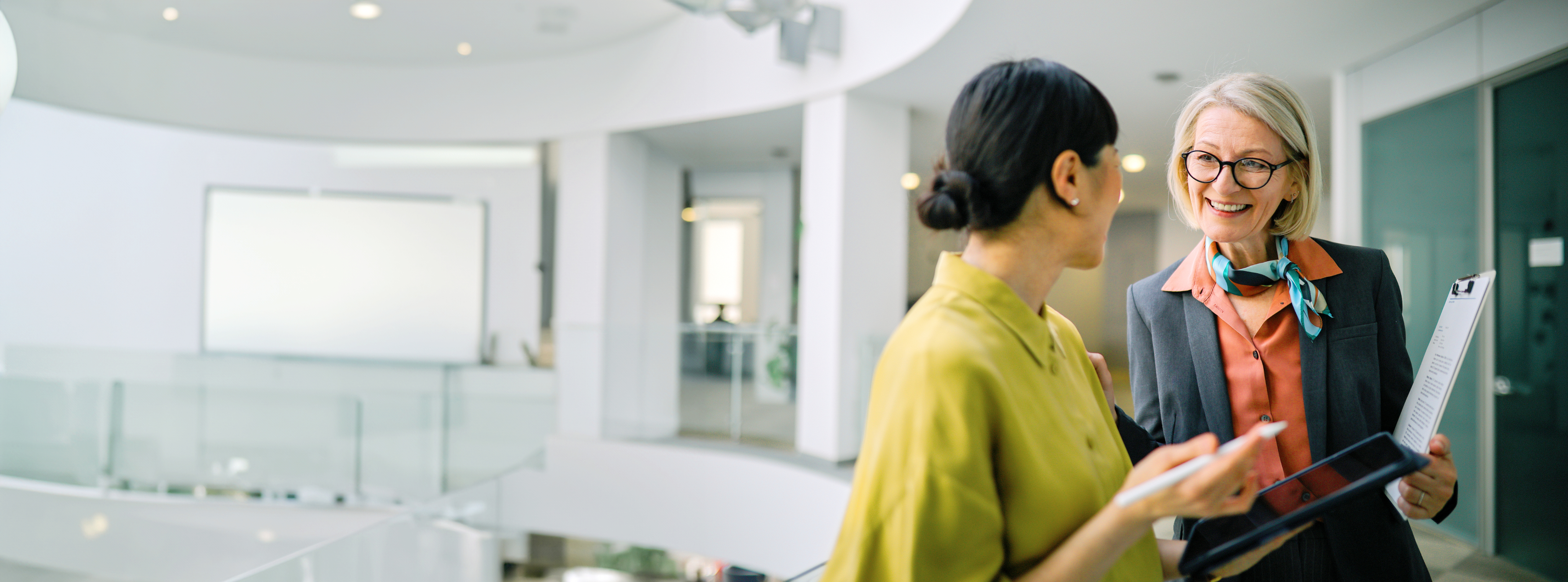 two women chatting in lobby