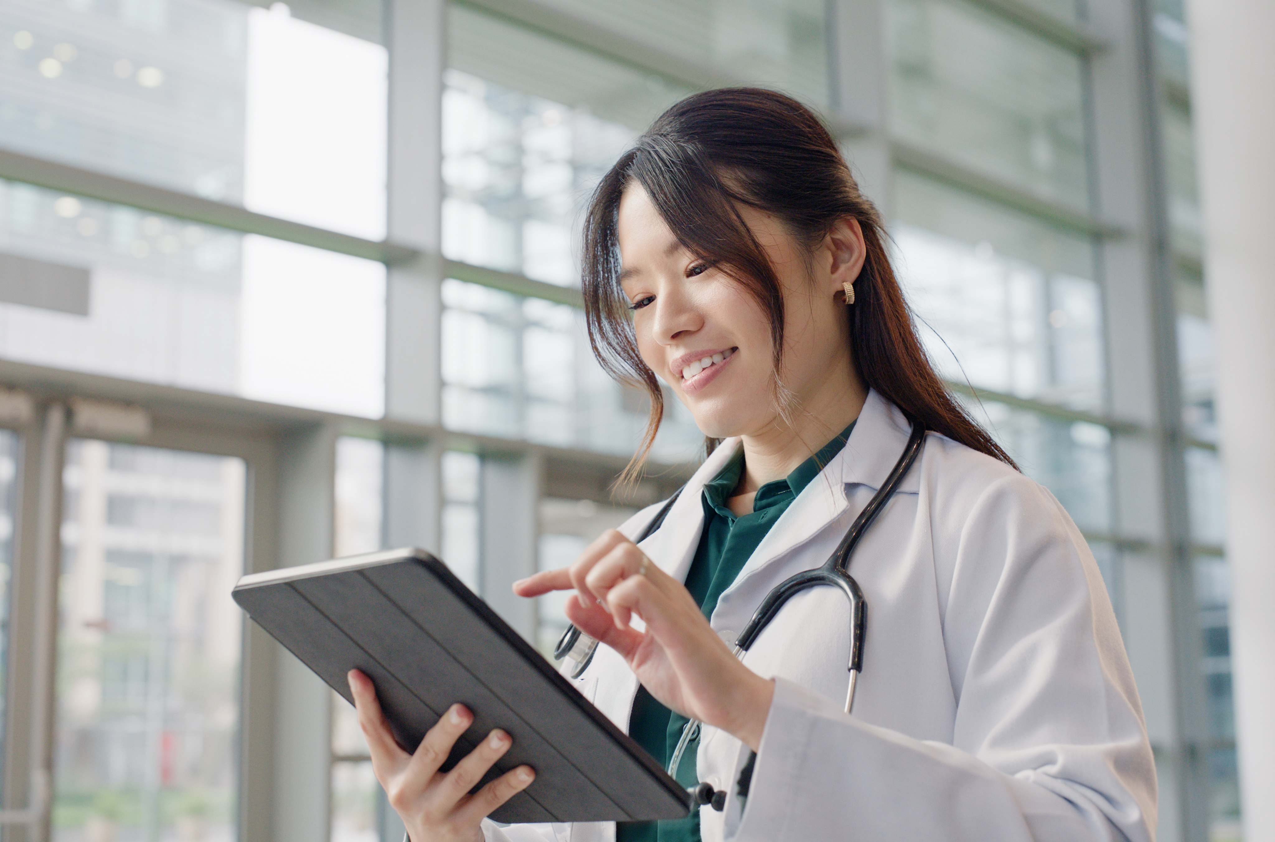 female doctor using tablet