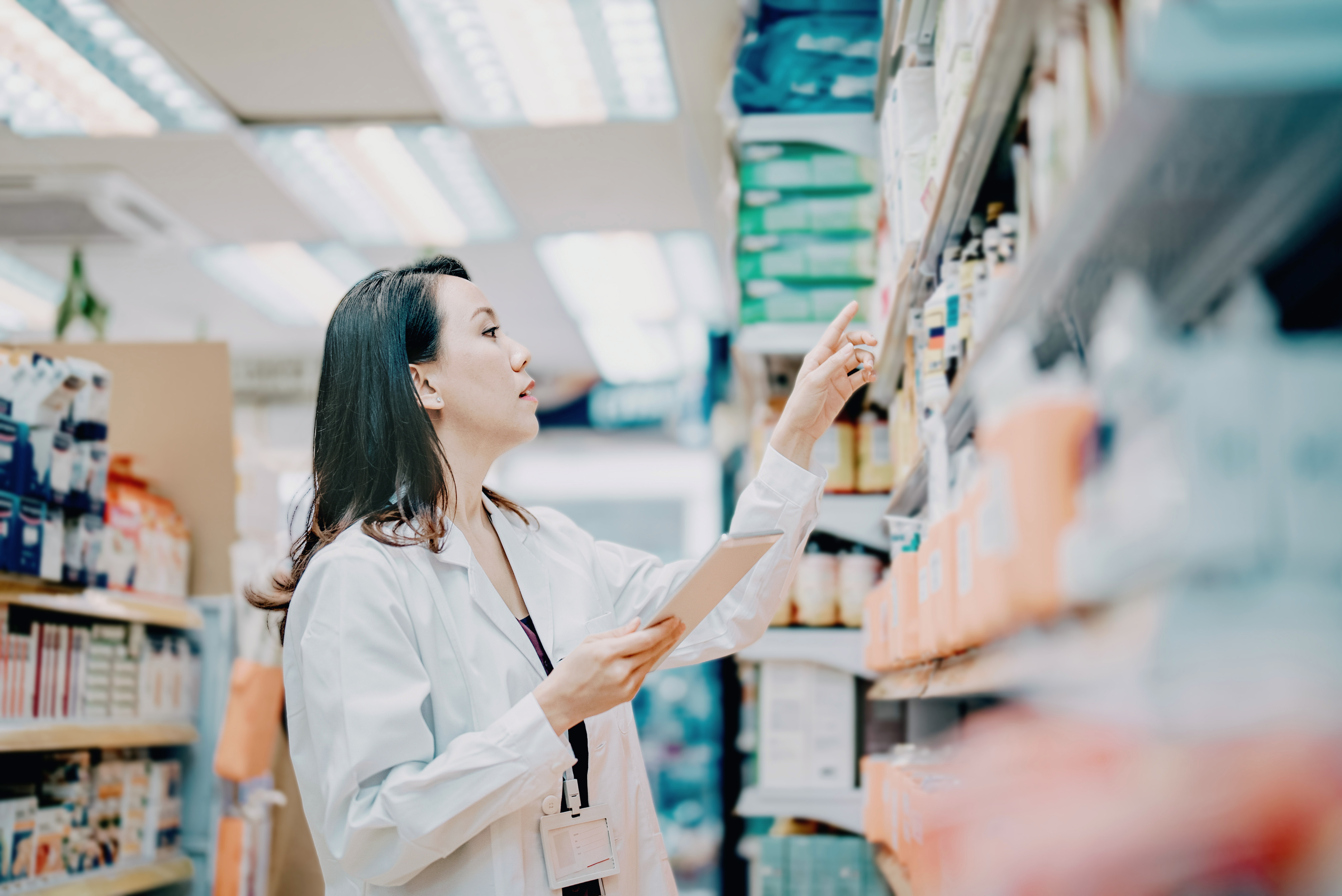 pharmacist grabbing prescription