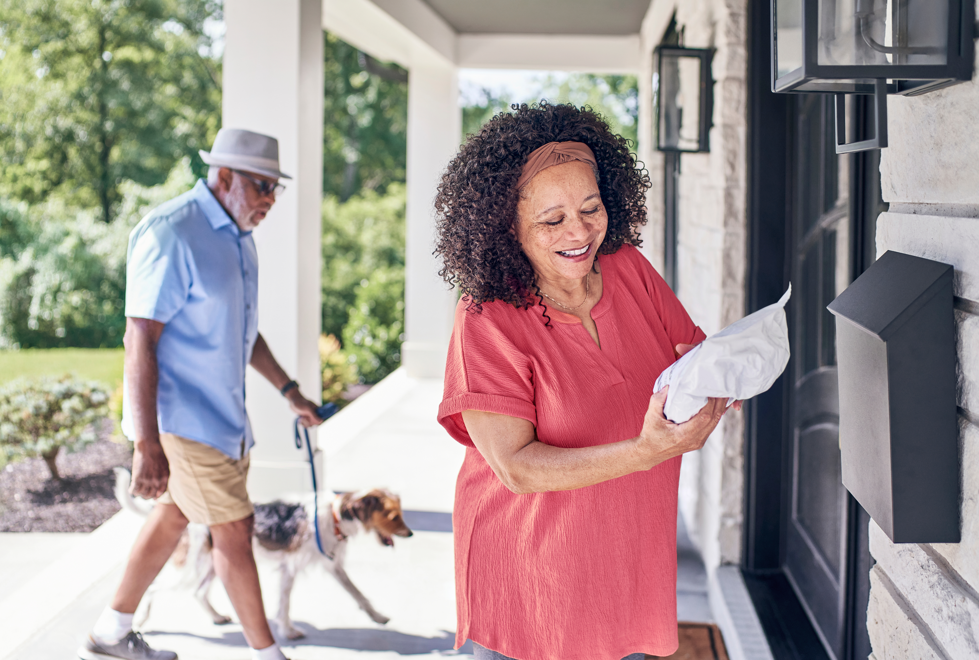 Woman getting prescription from mailbox