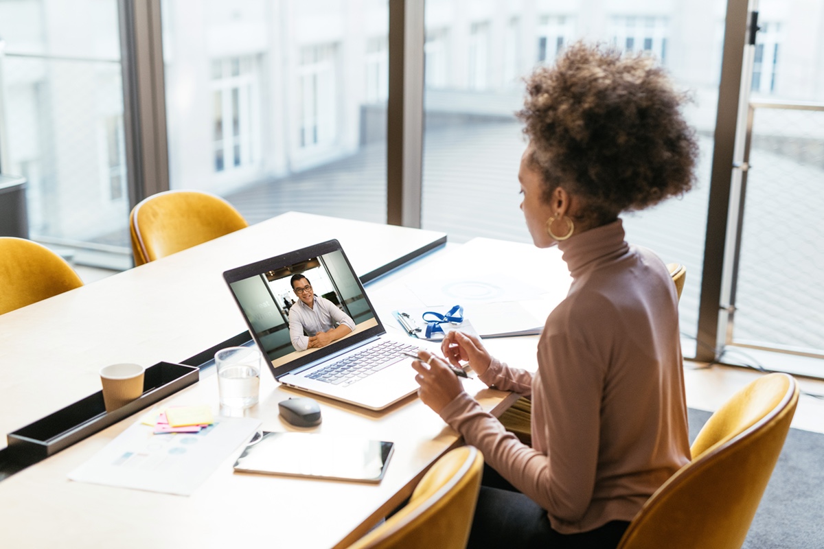 Woman having a virtual meeting at desk