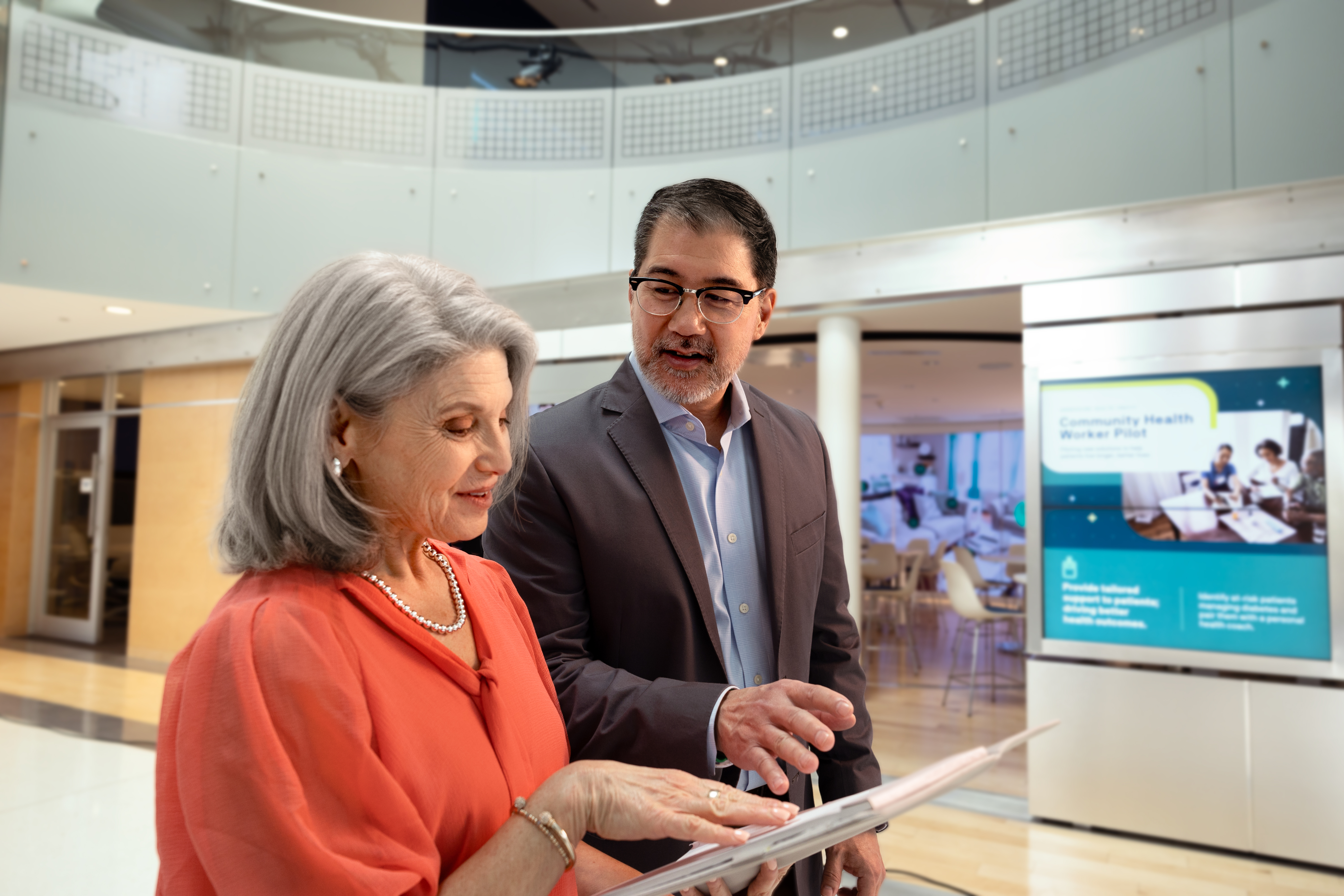 Woman talking to man at institute