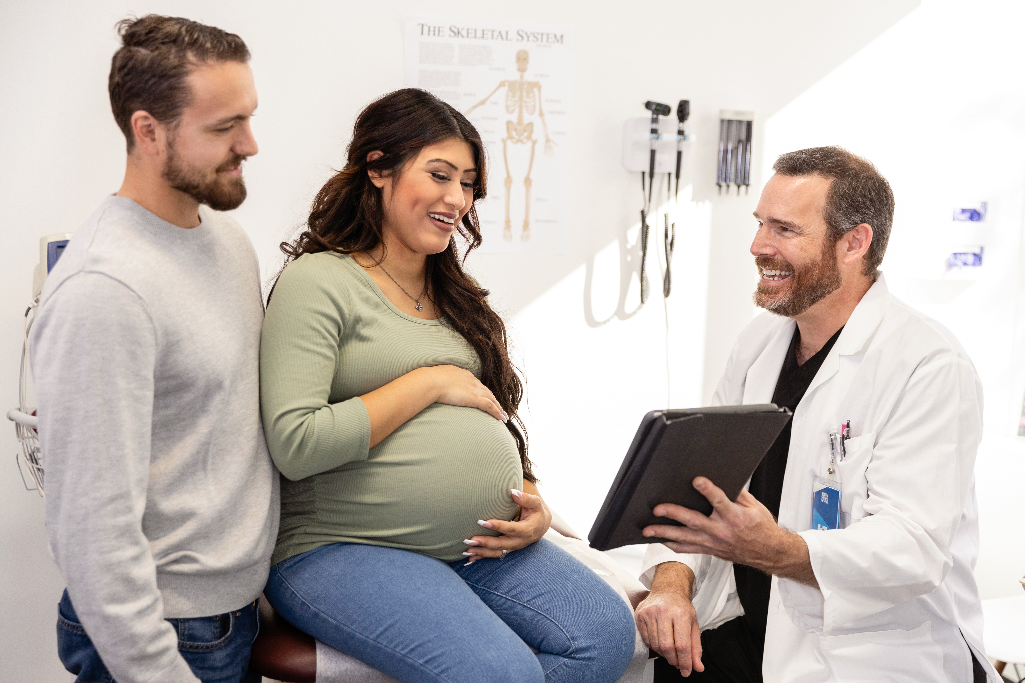 Pregnant couple consulting with physician - FamilyPath