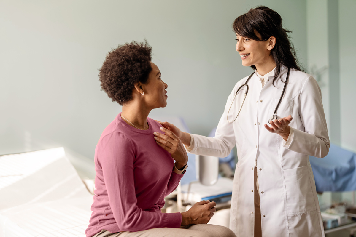 female doctor talking to female patient