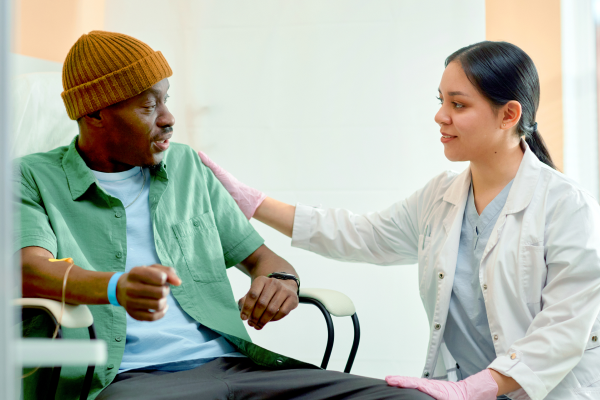 health care provider comforting her patient