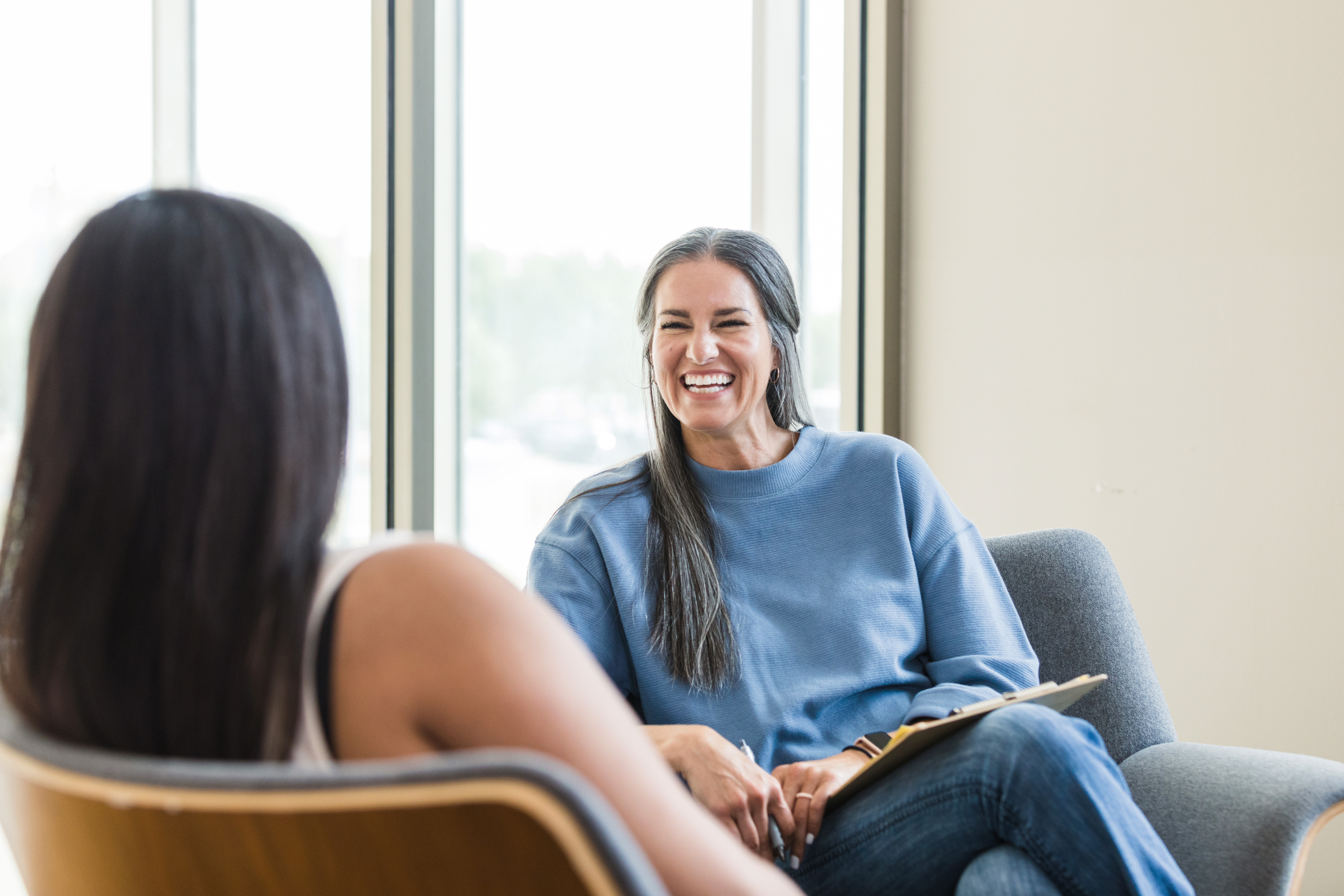 Woman talking to female therapist