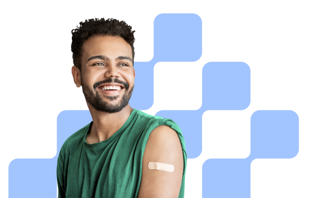 smiling man with small bandage on his arm