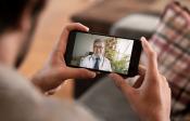 Patient uses phone to speak with physician via video chat