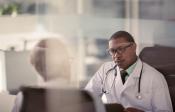 Two physicians in an office having a conversation