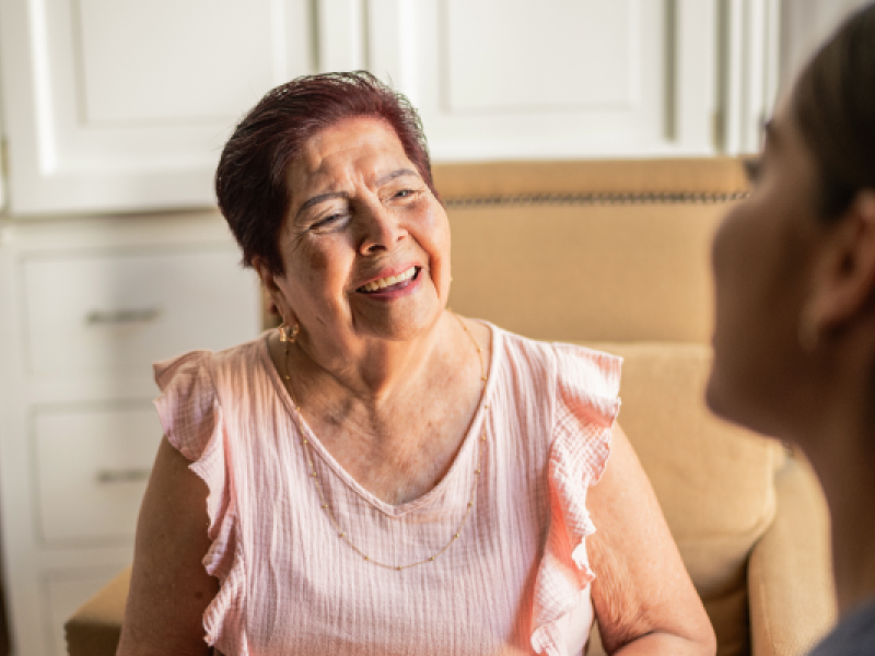 woman and her health care provider both smiling