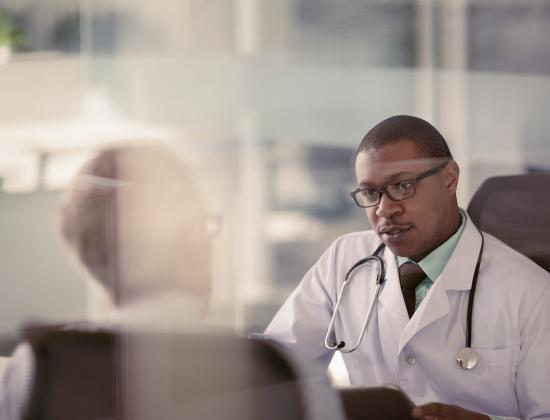 Two physicians in an office having a conversation