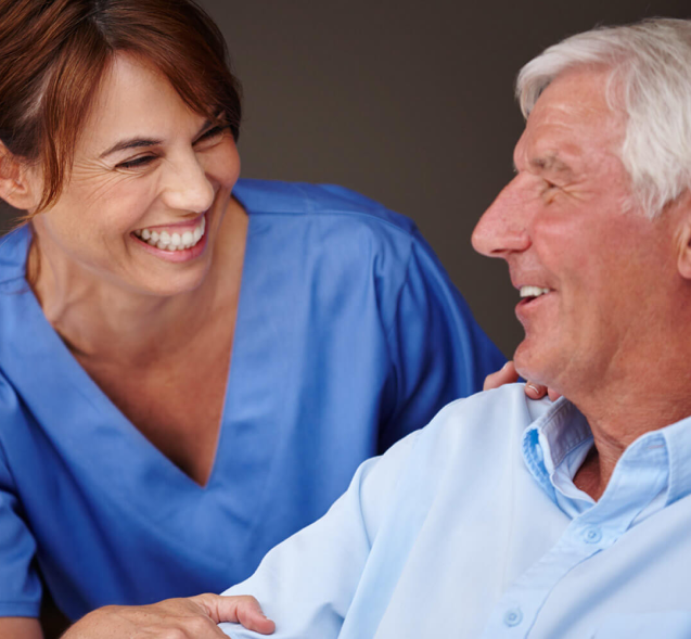 eviCore Evidence-Based Healthcare Solutions - Smiling medical professional nurse with smiling patient