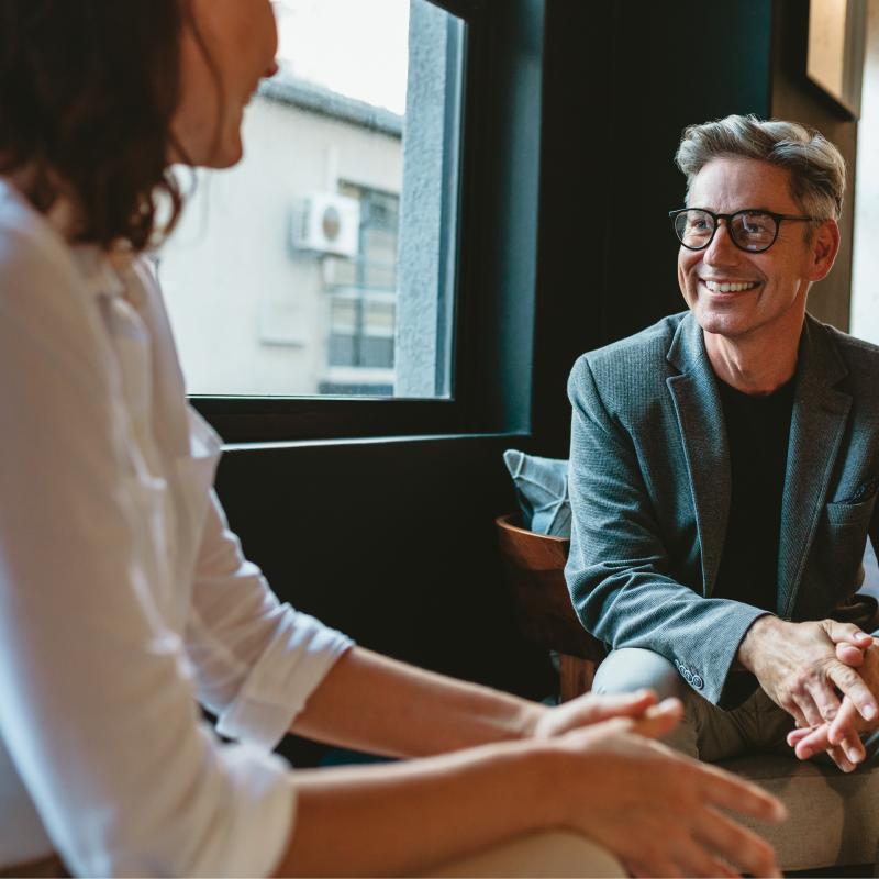 Counselor and patient smiling