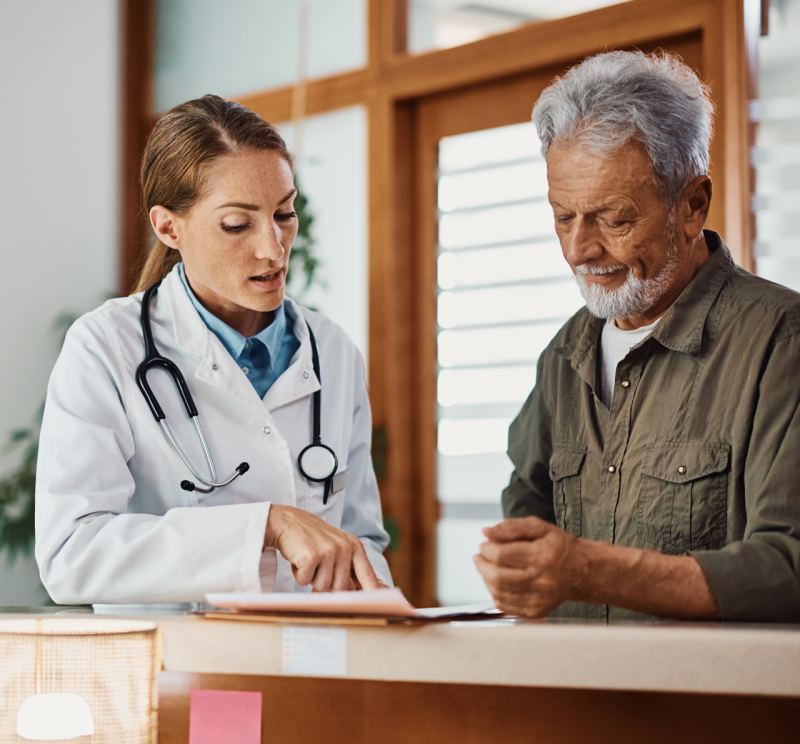 A doctor has a discussion with their patient