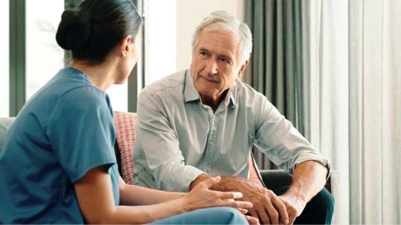 A medical professional consults with a patient