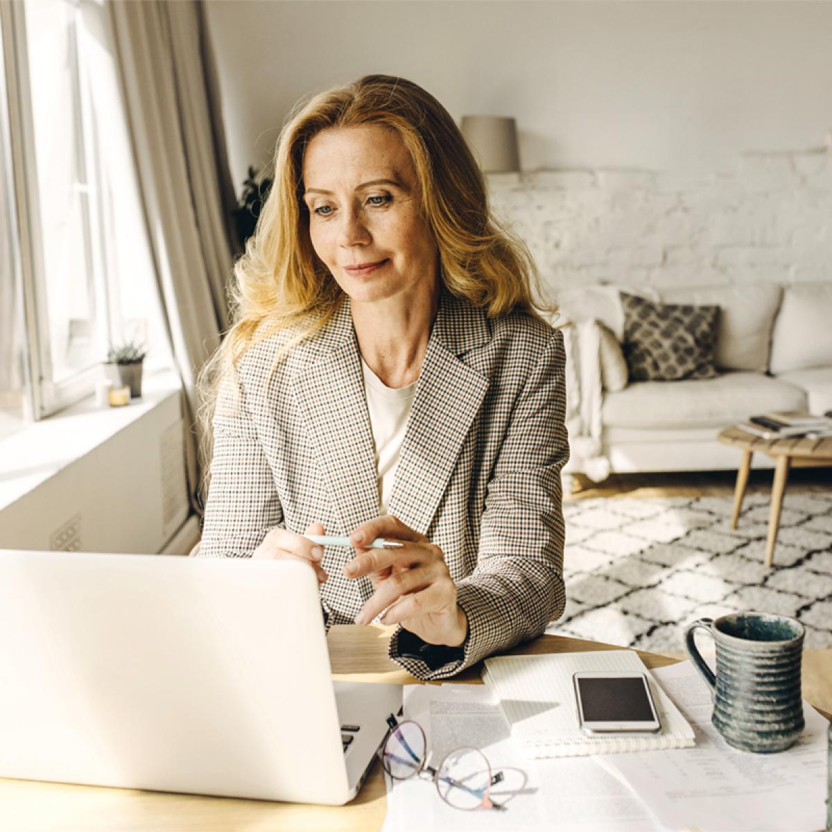 Woman looking at laptop