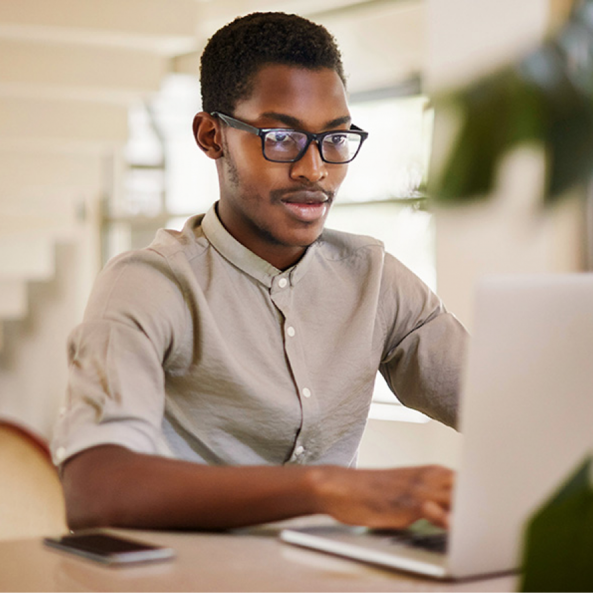 A person works on a laptop