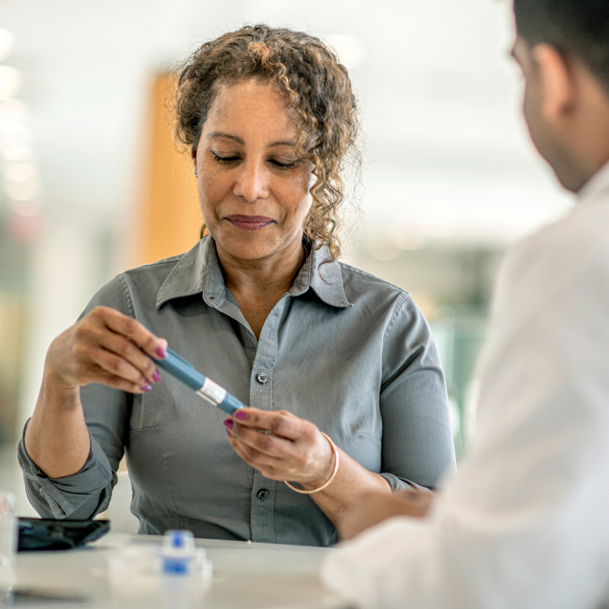 A pharmacist and patient discuss a diabetes drug