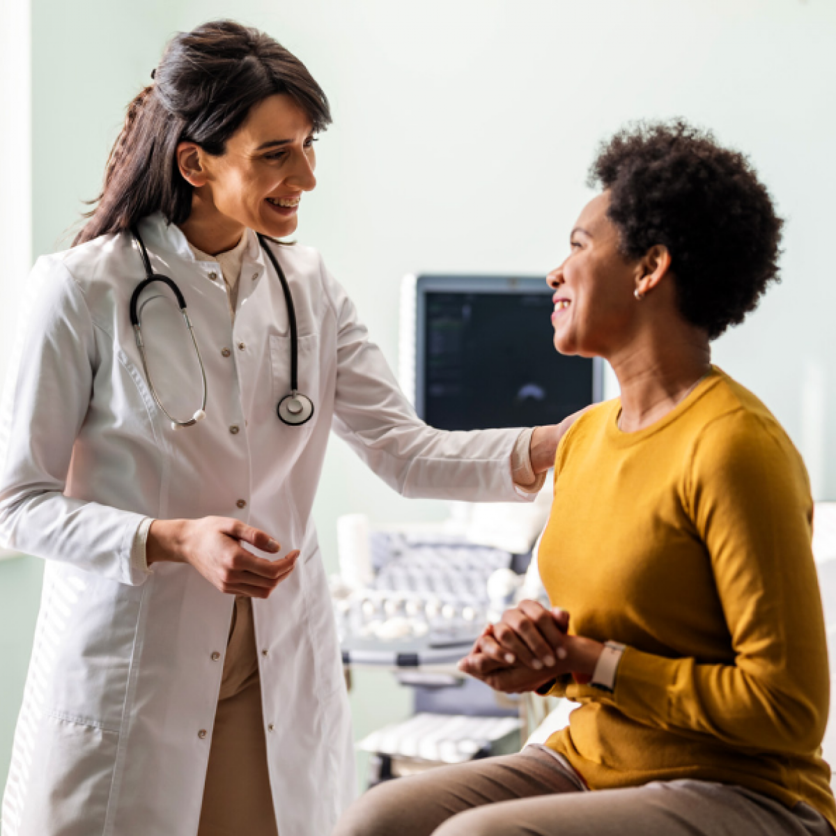 smiling doctor comforts her patient