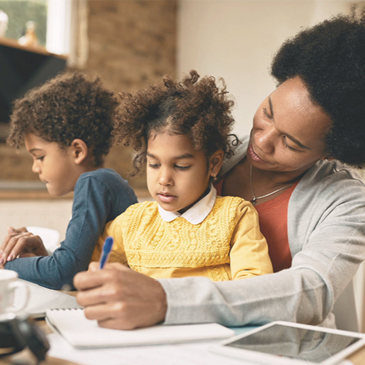 woman enjoying quality time with her two grandchildren