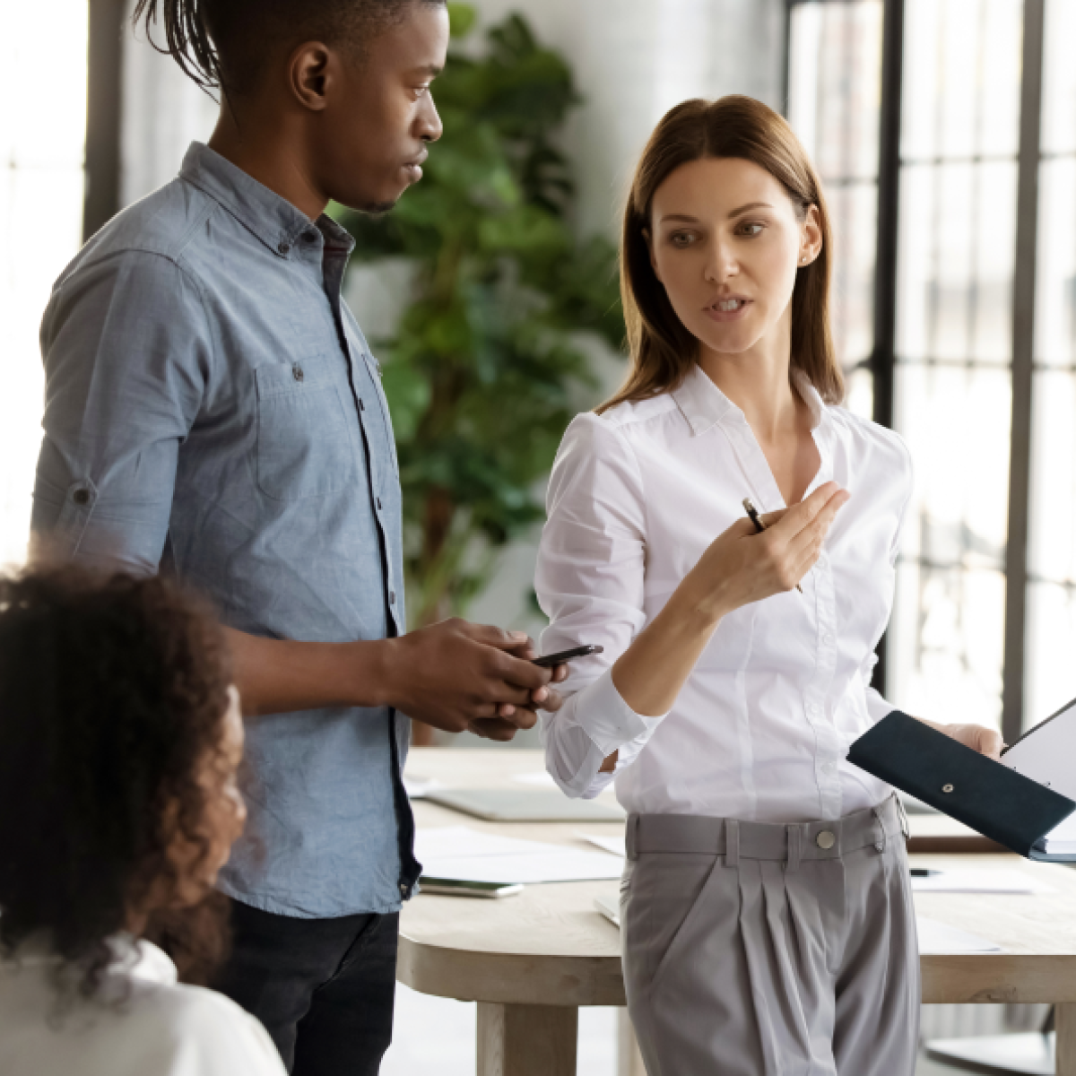 Man and woman standing in an office