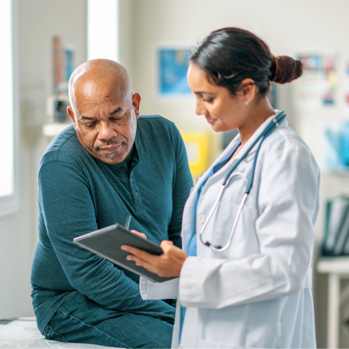 A doctor consults with a patient